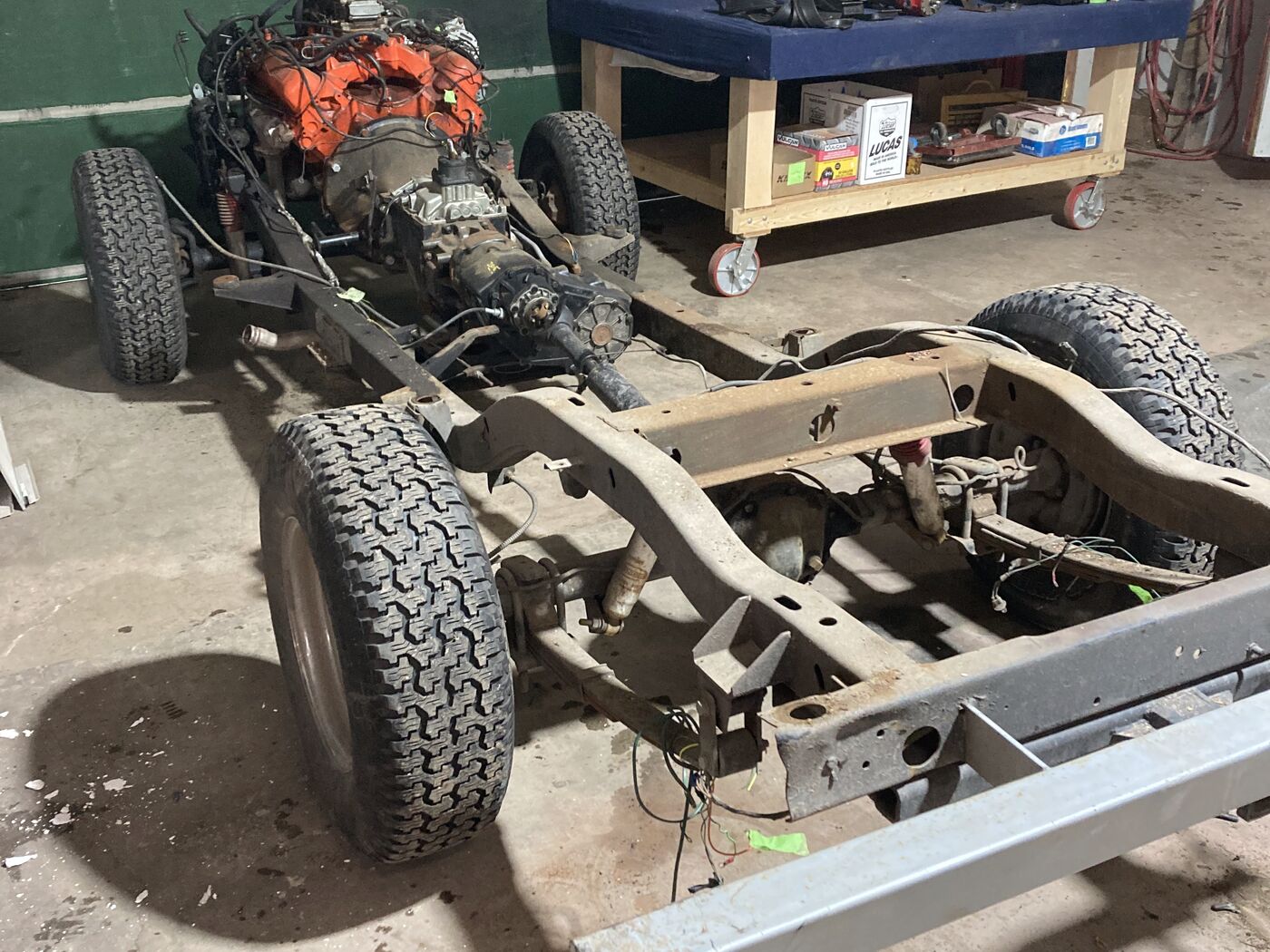 Scout II frame stripped bare with the drivetrain out during a frame off restoration at Jack's Custom Restoration