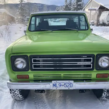 Front of a restored International Scout II in green with the new grille