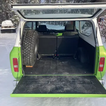 Scout II cargo area with the tailgate down and the spare mounted