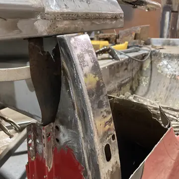Rusted pillar cut open to show how far the corrosion goes