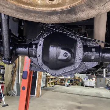 Rear axle and diff cleaned and coated under a truck