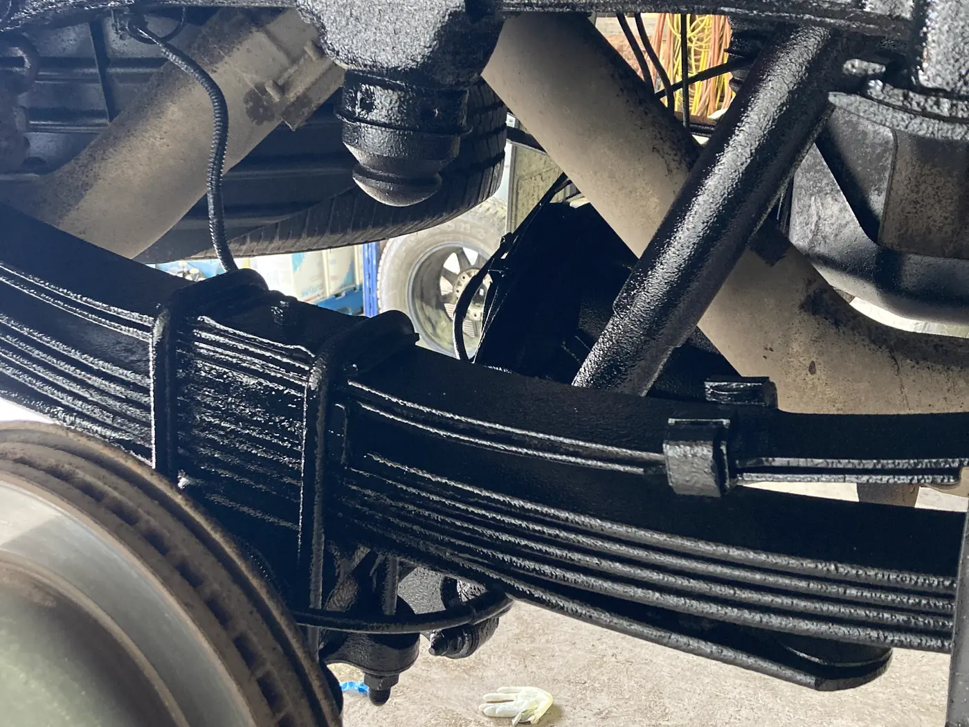 Leaf springs and rear suspension cleaned and coated black at Jack's Custom Restoration